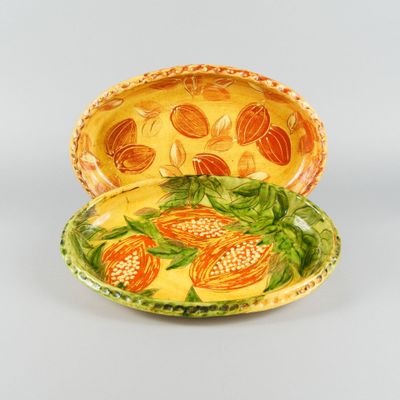 a yellow plate with a yellow and orange design on it