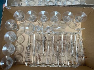 many empty wine glasses in a box on the table