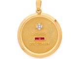 Gros plan sur un pendentif en or orné d'une croix