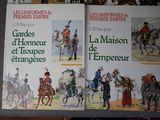 two books on the table with pictures of people riding horses