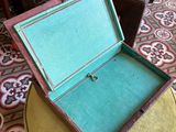 a small open box sitting on a table in a living room