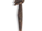 a small wooden object with a bird on top of it