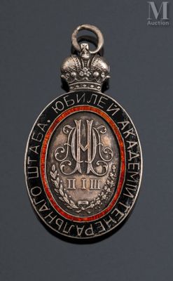 a close up of a medal with a crown on top of it