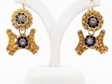 an image of a pair of earrings with blue and white stones