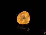 a yellow diamond on a black background