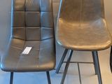 three chairs sitting next to each other in a room