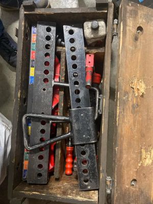 a wooden box with a bunch of tools inside of it