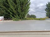 a skateboarder doing a trick on a ramp at a skate park