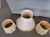 three lamps that are sitting on the floor next to each other