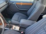 a picture of the interior of a car with a steering wheel