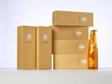 three boxes of champagne and a bottle of champagne sitting on a table
