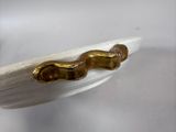 a banana that has been dipped with gold on it