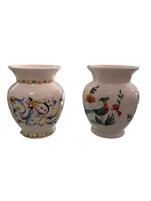 two vases sitting side by side on a white background