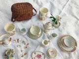 a lot of tea cups and saucers sitting on a table