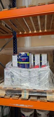 a pallet of paint on a shelf in a warehouse