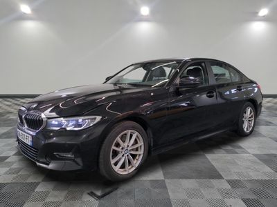 a picture of a black bmw car on a checkered floor