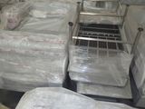 a room filled with lots of mattresses and other items
