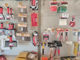 many different tools on the wall in the shop