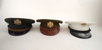 three hats sitting on top of each other on a table