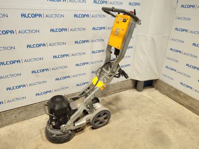 un gros plan d'une petite machine posée sur le sol d'une pièce