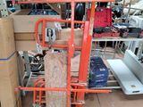 a stack of boxes on a cart in a warehouse