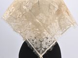 a white lace shawl on a mannequin mannequin mannequin mannequin mannequin mannequin mannequin mannequin mann