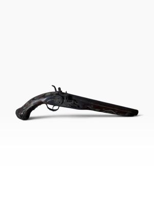 an old gun with a wooden handle on a white background