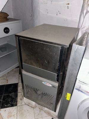 an image of a kitchen with a washing machine and a dryer