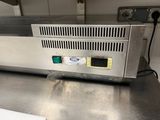 stainless steel counter top in a commercial kitchen with electronic controls