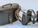 two binoculars sitting next to each other on a white surface