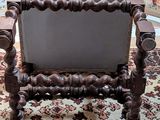 a chair that is sitting on a rug in a room
