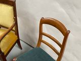 two chairs that are next to each other on the floor
