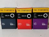 three boxes of delta film sitting next to each other on a table