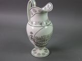 a white vase with a black and white design on it