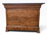 an image of a wooden chest of drawers with a marble top