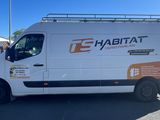 a white van that is parked in a parking lot