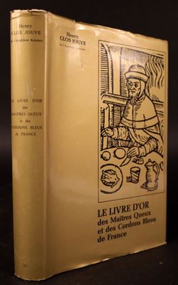 a yellow book with a drawing of a man sitting at a table