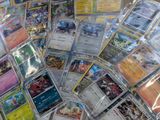 many different types of pokemon cards on the table