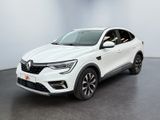 a white car is parked in a white room with a black floor