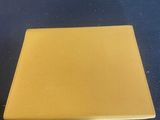 an image of a yellow plate sitting on top of a blue table