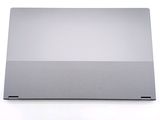 the back of a silver laptop computer sitting on top of a white surface