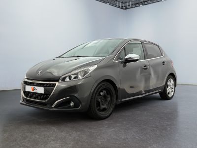 the new peugeot car is parked in a large room
