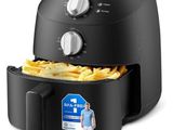 a black air fryer with french fries in it