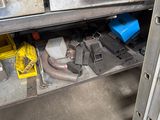 an image of a metal workbench with tools on it