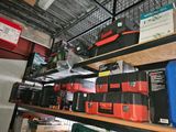 many different tools on the shelves in the garage
