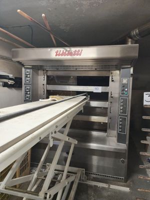 an image of a commercial kitchen with a conveyor belt