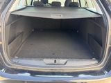 the back of a car with the trunk open and the seats folded down