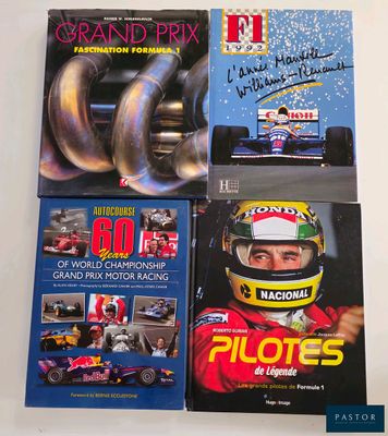 three books on a white table with a picture of a man in a racing car