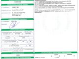 a green and white document with a barcode on it