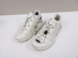 pair of white sneakers with laces on them sitting on a white surface